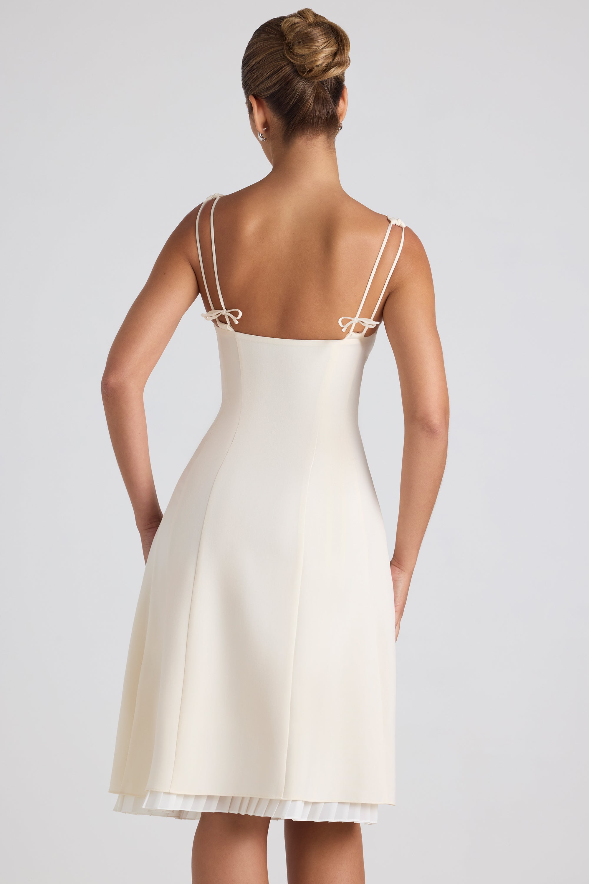 Isadora Bow-Detail Pleated A-Line Midi Dress in Ivory | Oh Polly Isadora Bow-Detail Pleated A-Line Midi Dress in Ivory | Oh Polly