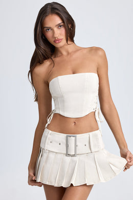 Belted Pleated Low-Rise Micro Mini Skirt in Ecru