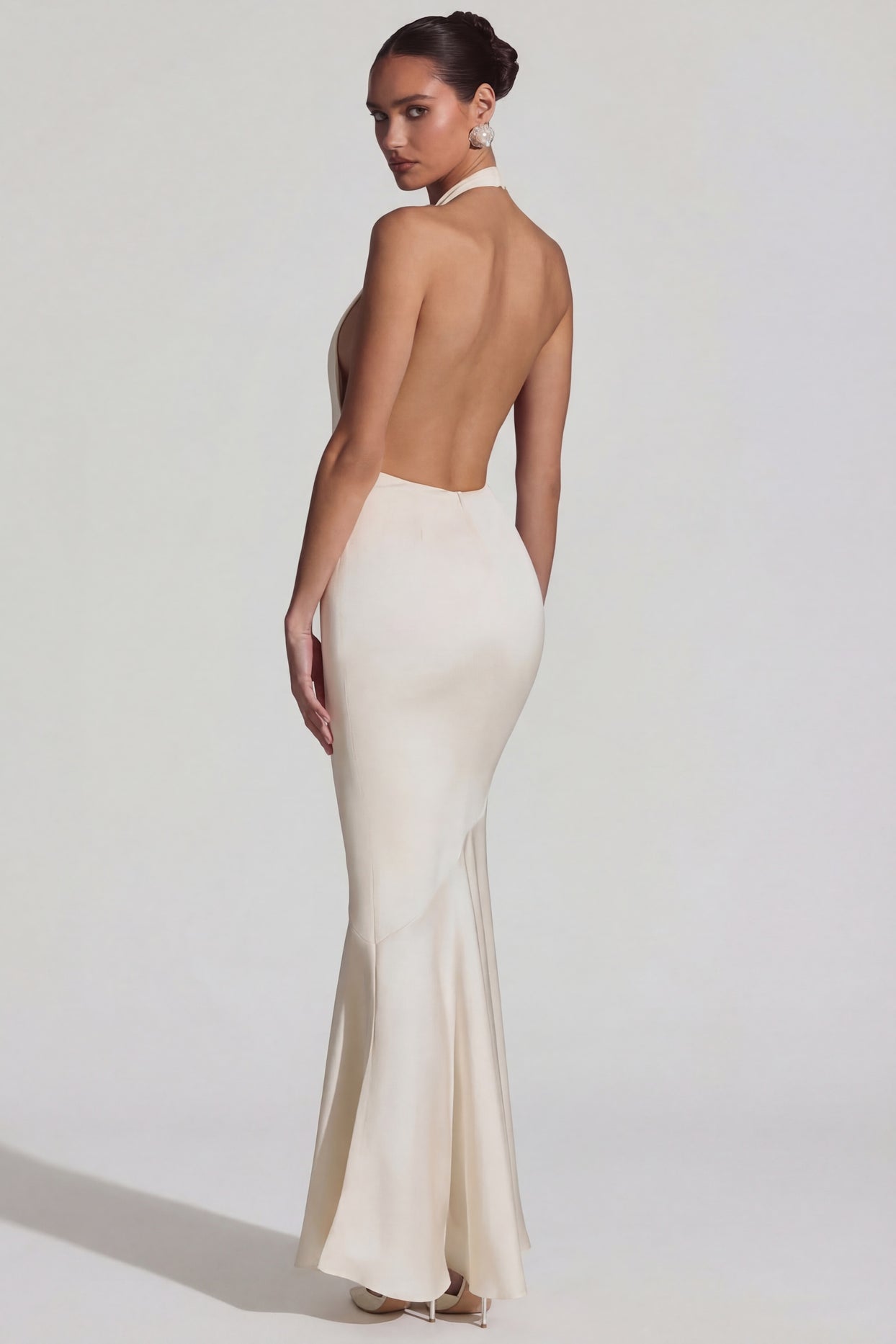 Oh Polly's Priscilla wearing the Desiree Gown Length Dress in Ivory Satin fabric perfect for elegant evening events