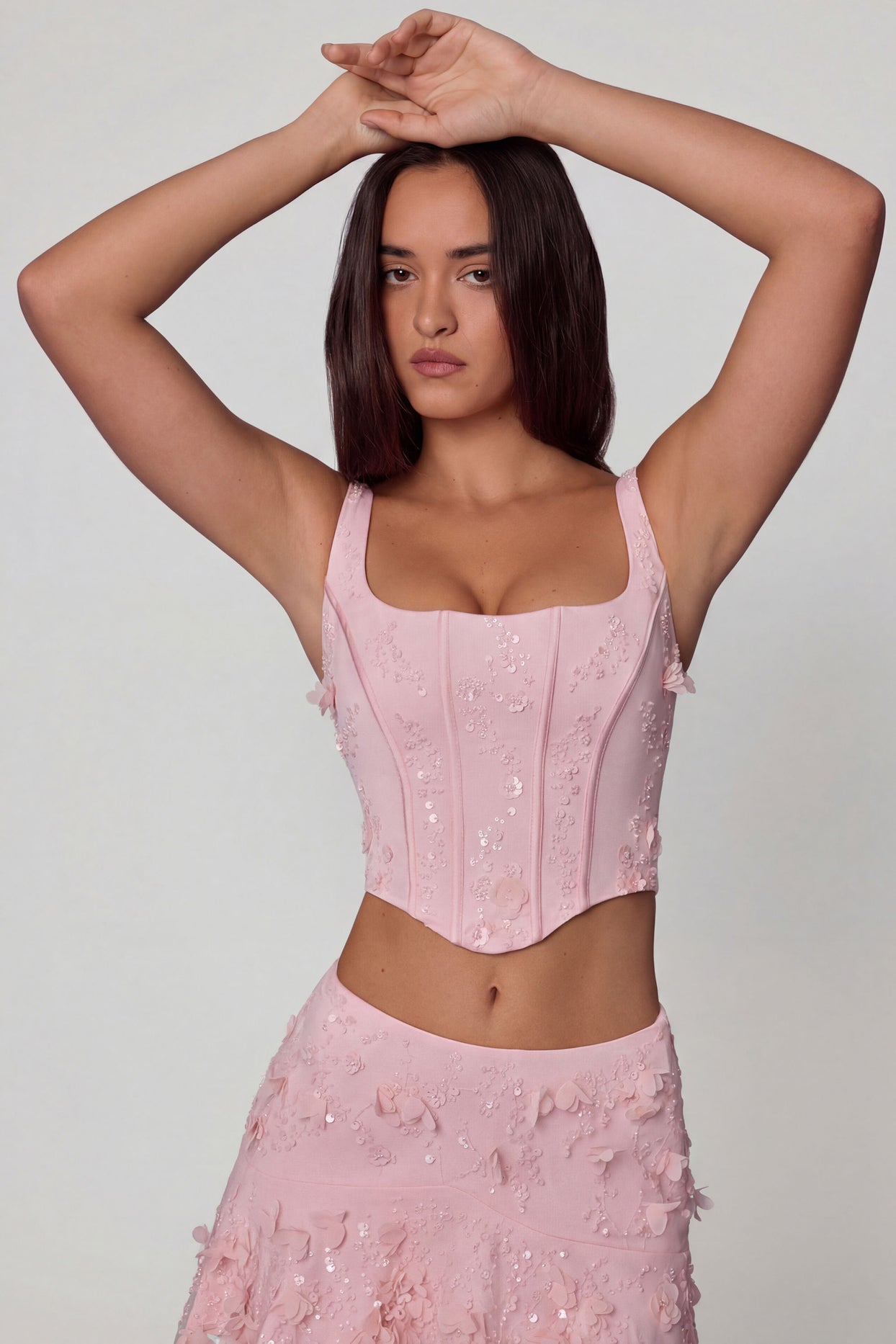 Oh Polly's Roberta wearing the Letitia Corset Top in Ballet Pink Embellished fabric perfect for chic cocktail parties