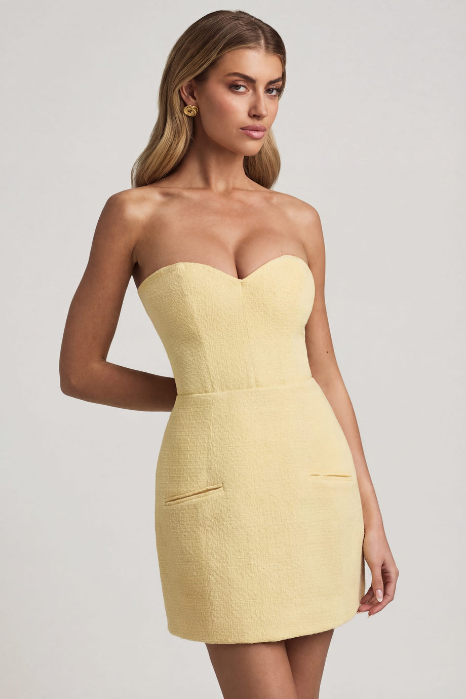 Oh Polly's Freya Tidy wearing the Talina Mini Dress in Pastel Yellow Tweed fabric perfect for rooftop evening drinks