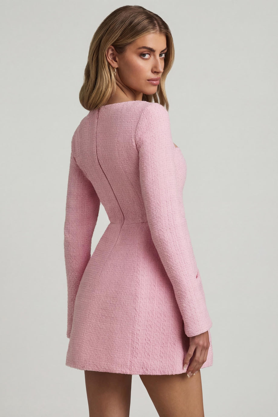 Oh Polly's Freya Tidy wearing the Tacita Mini Dress in Soft Pink Tweed fabric perfect for spring garden parties