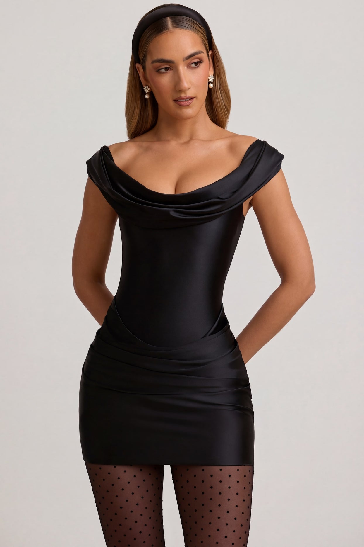 Oh Polly's Priscilla wearing the Maeve Mini Dress in Black Satin Jersey fabric perfect for a cocktail party