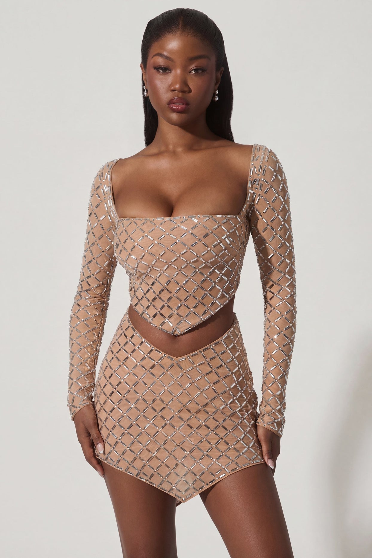 Oh Polly's Sevah wearing the Veah Mini Skirt in Almond Square Hotfix fabric perfect for birthday celebrations