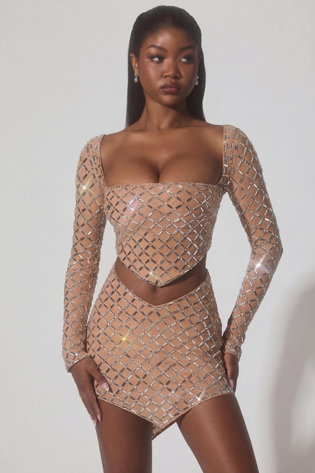 Oh Polly's Sevah wearing the Veah Mini Skirt in Almond Square Hotfix fabric perfect for rooftop gatherings