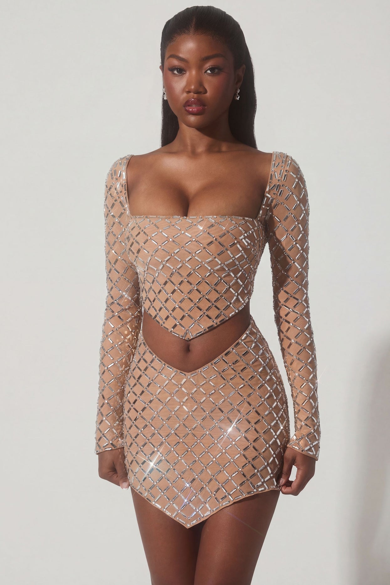 Oh Polly's Sevah wearing the Thora Crop Top in Almond Square Hotfix fabric perfect for holiday getaways