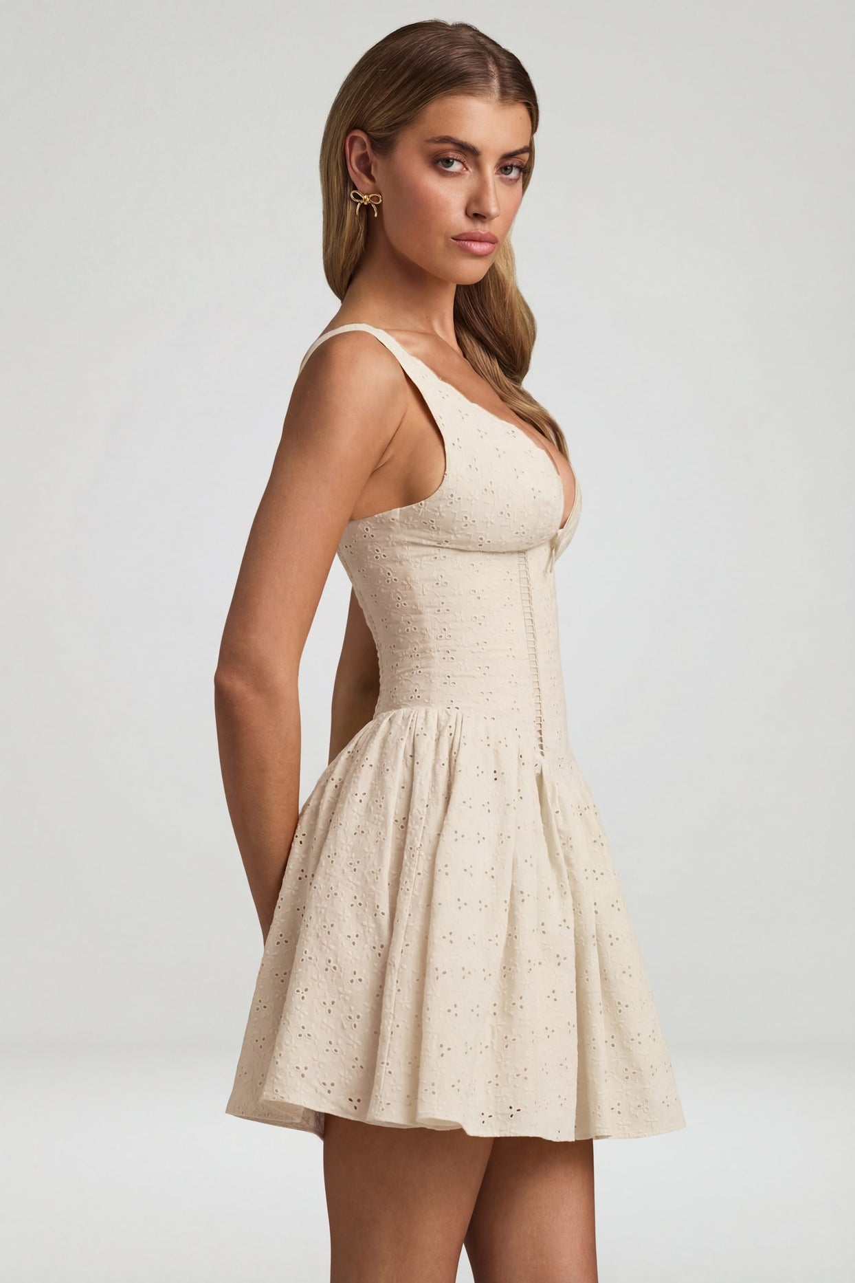 Oh Polly's Freya Tidy wearing the Sabina Mini Dress in Ivory Woven fabric perfect for rooftop brunch dates