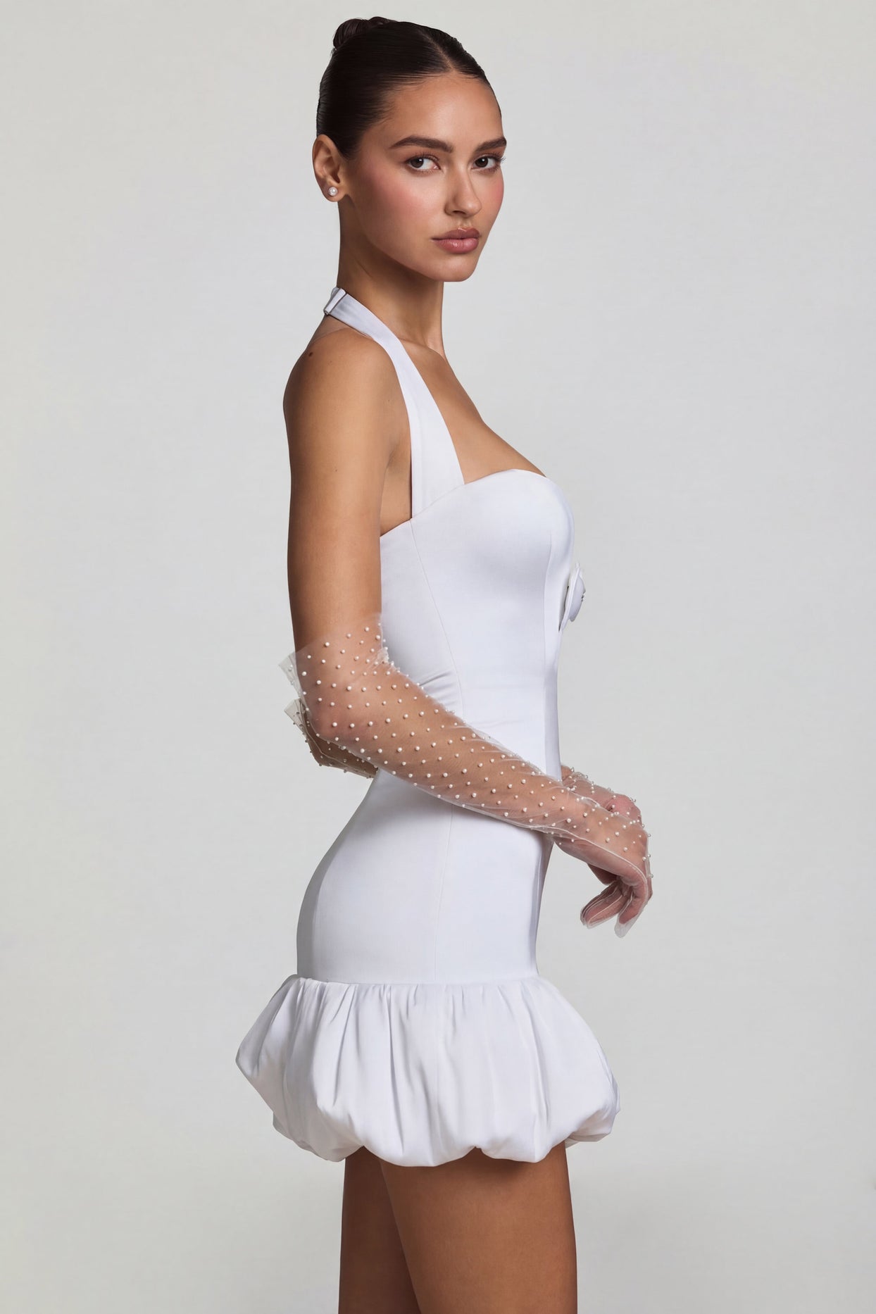 Oh Polly's Anna wearing the Millie Mini Dress in White Recycled Satin fabric perfect for summer garden parties