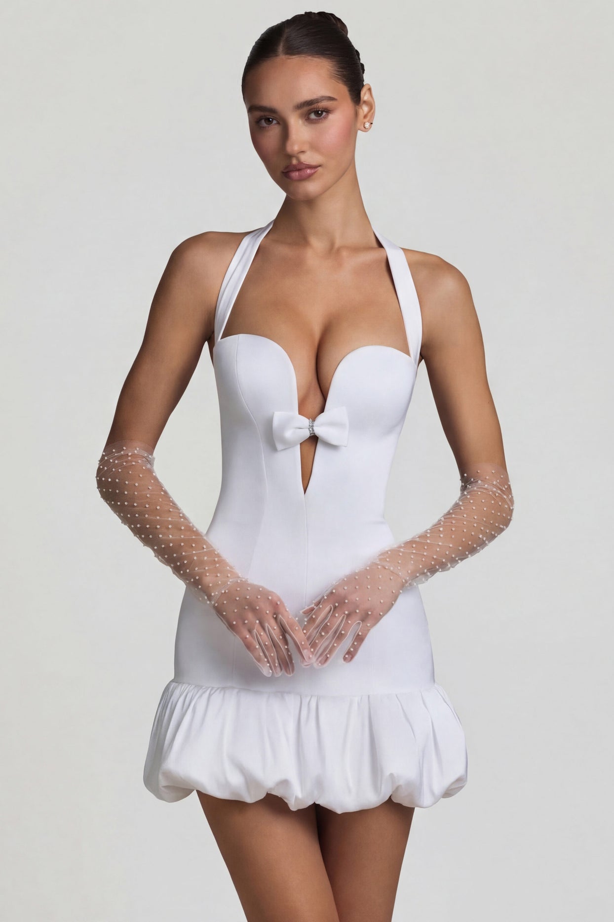 Oh Polly's Anna wearing the Millie Mini Dress in White Recycled Satin fabric perfect for rooftop brunches