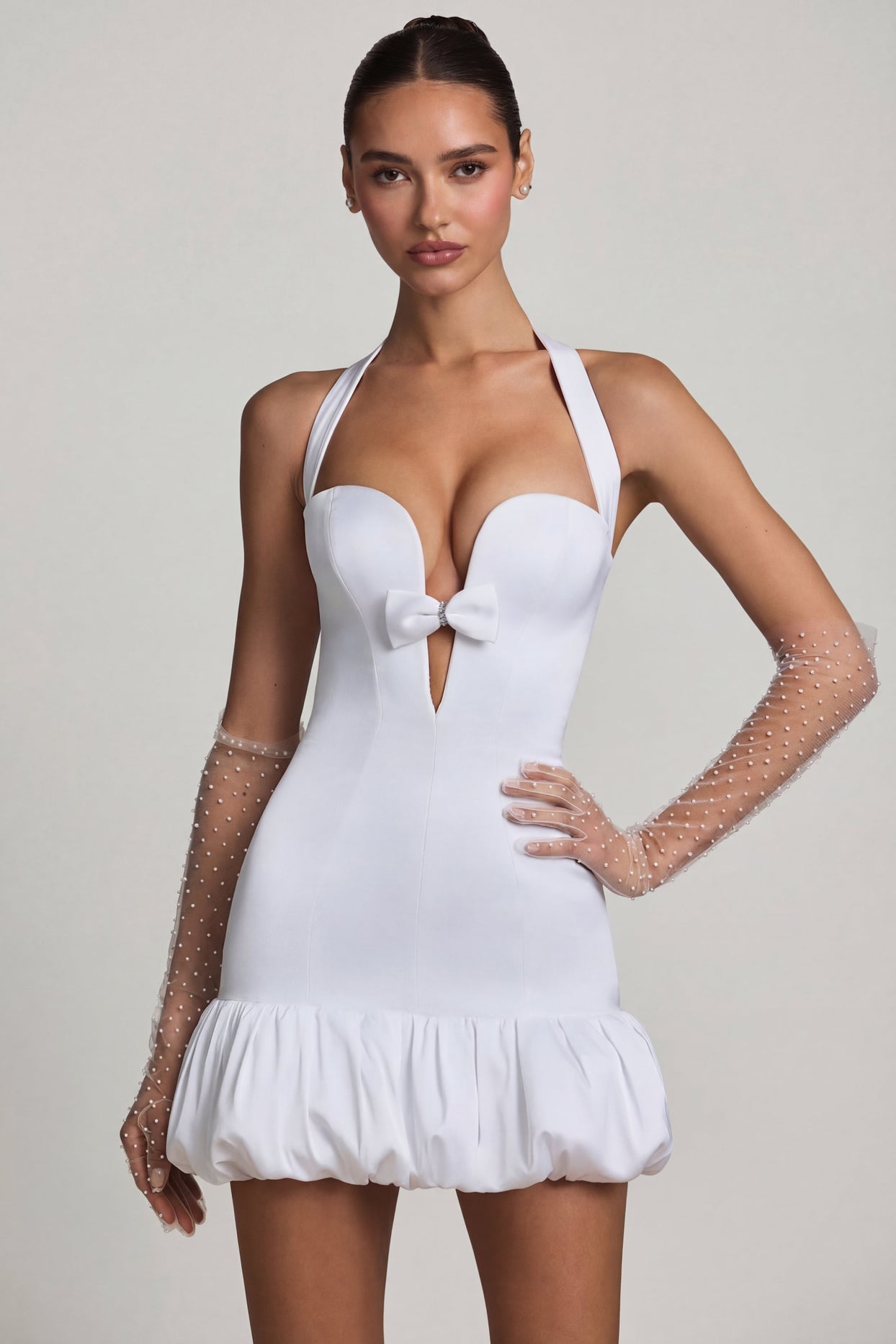 Oh Polly's Anna wearing the Millie Mini Dress in White Recycled Satin fabric perfect for cocktail evenings