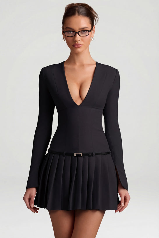 Oh Polly's Anna wearing the Fiorella Mini Dress in Black Stretch Woven fabric perfect for a night out