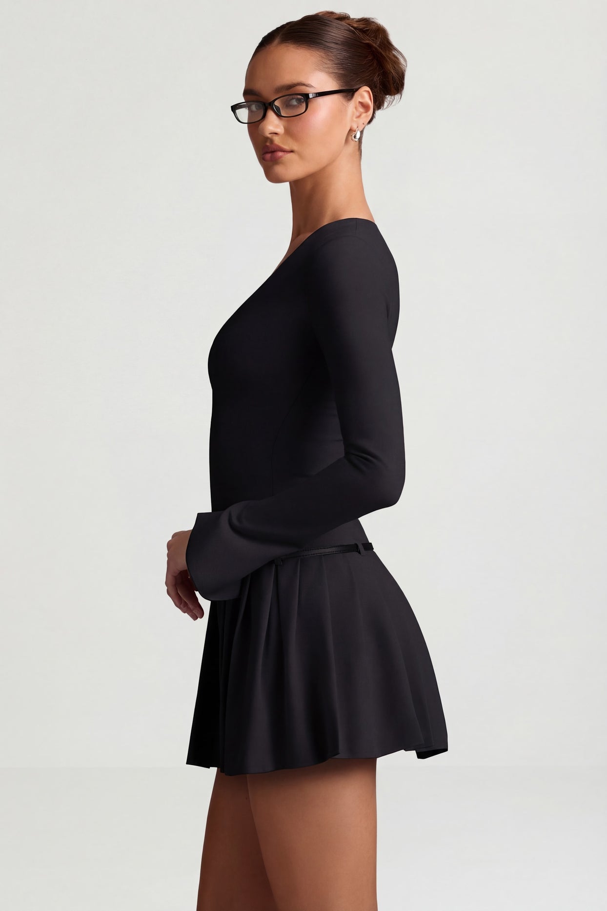 Oh Polly's Anna wearing the Fiorella Mini Dress in Black Stretch Woven fabric perfect for cocktail parties