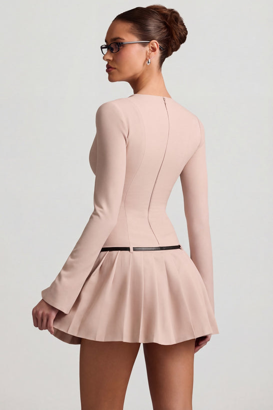 Oh Polly's Anna wearing the Fiorella Mini Dress in Mushroom Stretch Woven fabric perfect for a night out