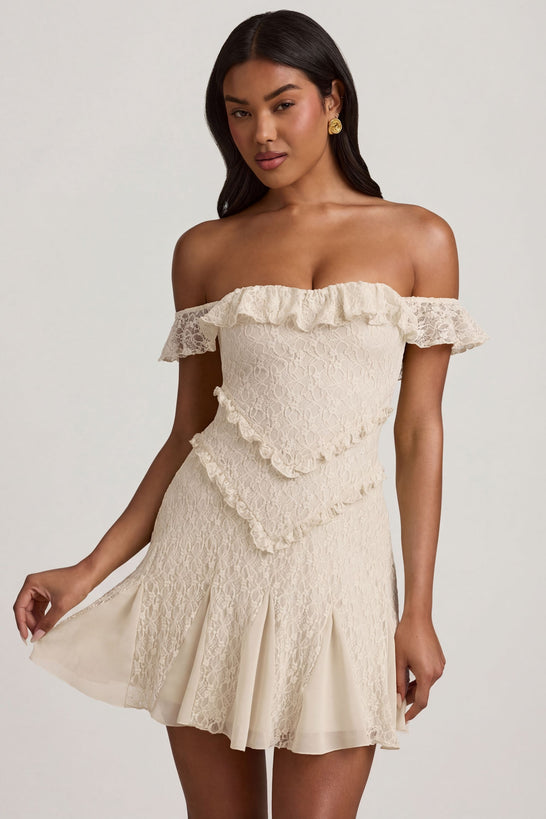Oh Polly's Yarelis wearing the Nahida Mini Dress in Ivory Stretch Lace fabric perfect for romantic date nights