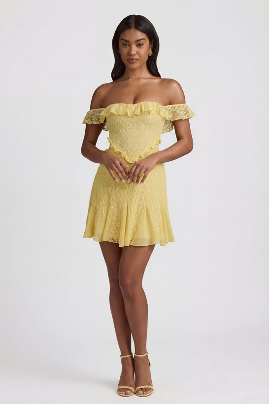 Oh Polly's Yarelis wearing the Nahida Mini Dress in Pastel Yellow Stretch Lace fabric perfect for birthday celebrations