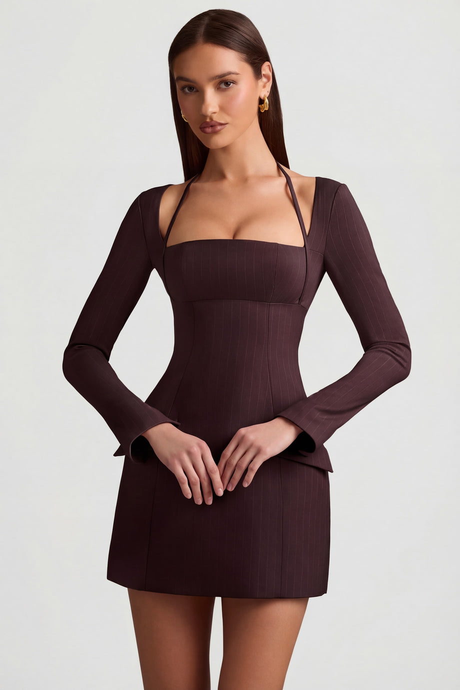Oh Polly's Anna wearing the Ksenia Mini Dress in Chocolate Brown Stretch Woven fabric perfect for birthday celebrations