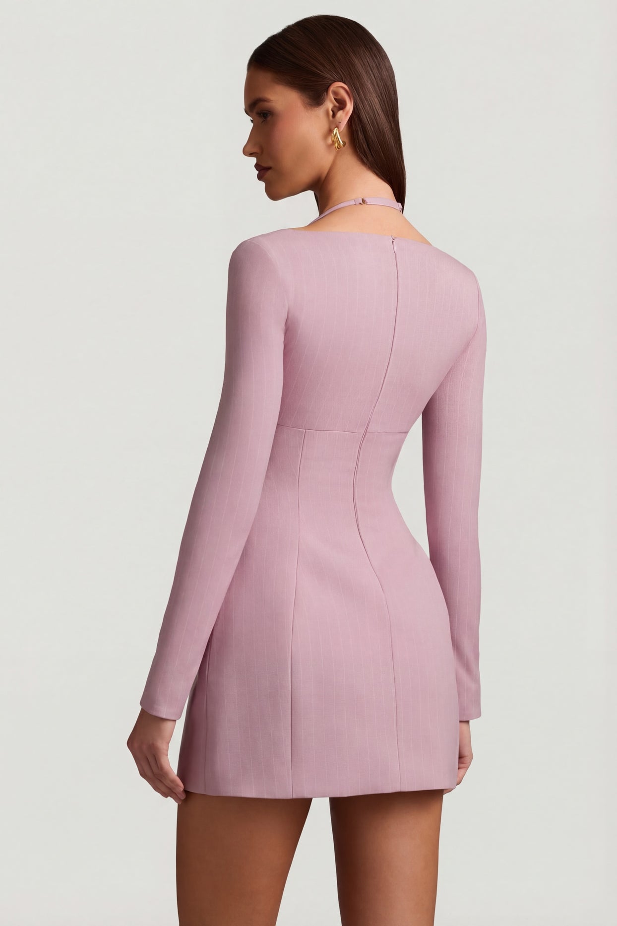 Oh Polly's Anna wearing the Ksenia Mini Dress in Mauve Stretch Woven fabric perfect for a cocktail party