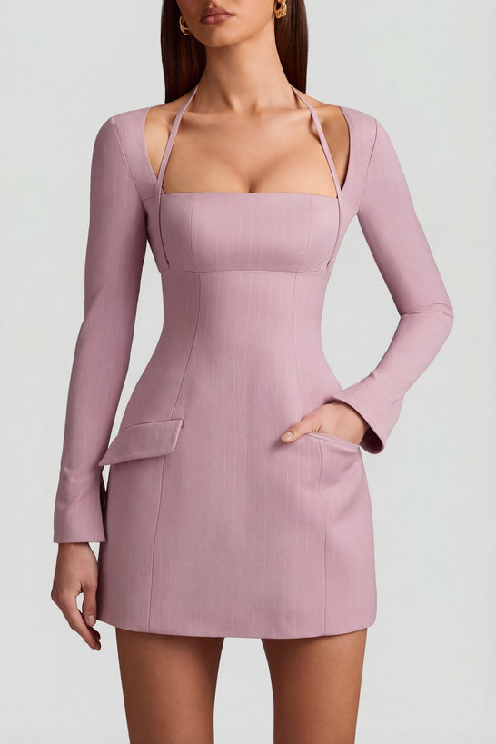 Oh Polly's Anna wearing the Ksenia Mini Dress in Mauve Stretch Woven fabric perfect for a girls' night out