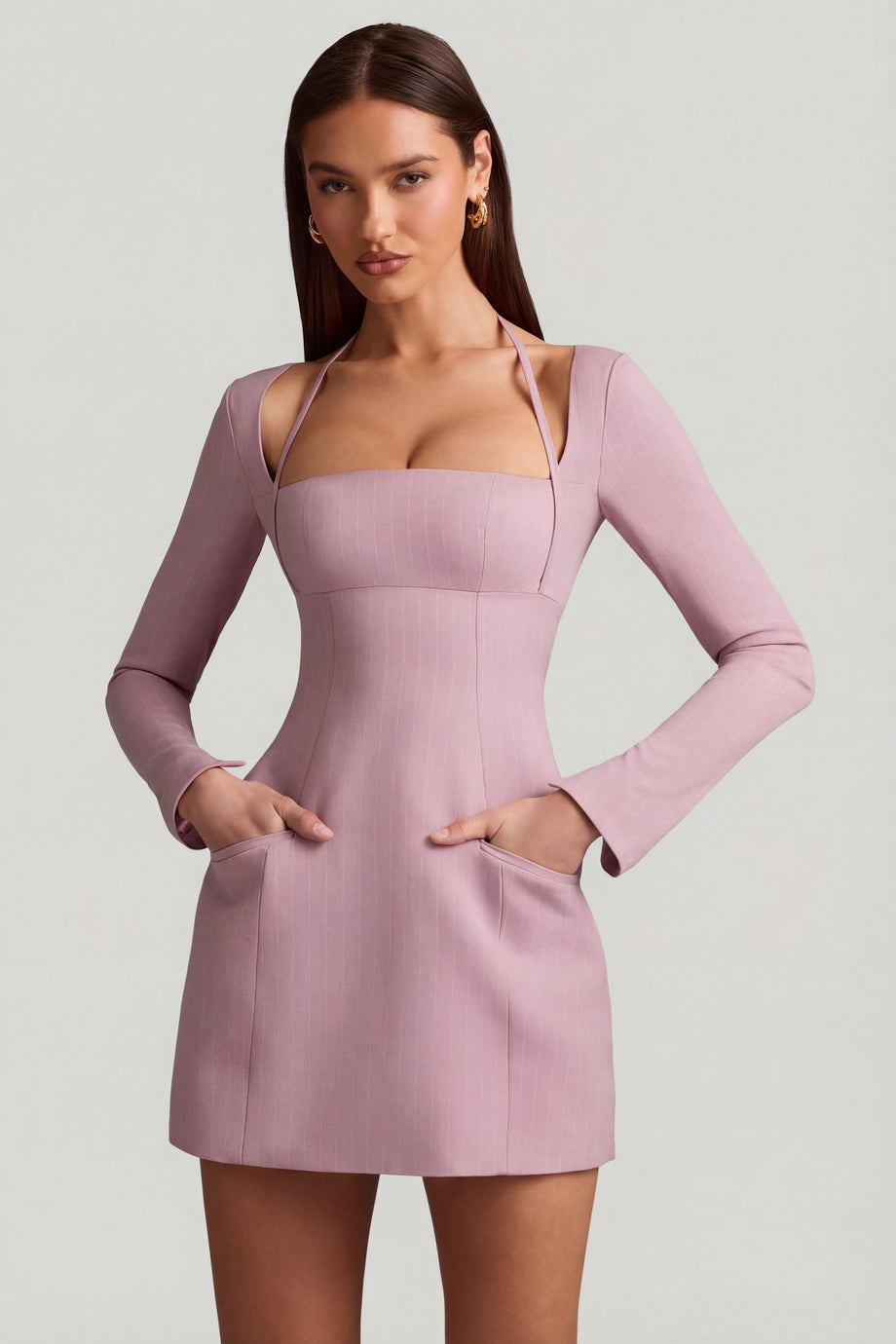 Oh Polly's Anna wearing the Ksenia Mini Dress in Mauve Stretch Woven fabric perfect for a wedding guest look