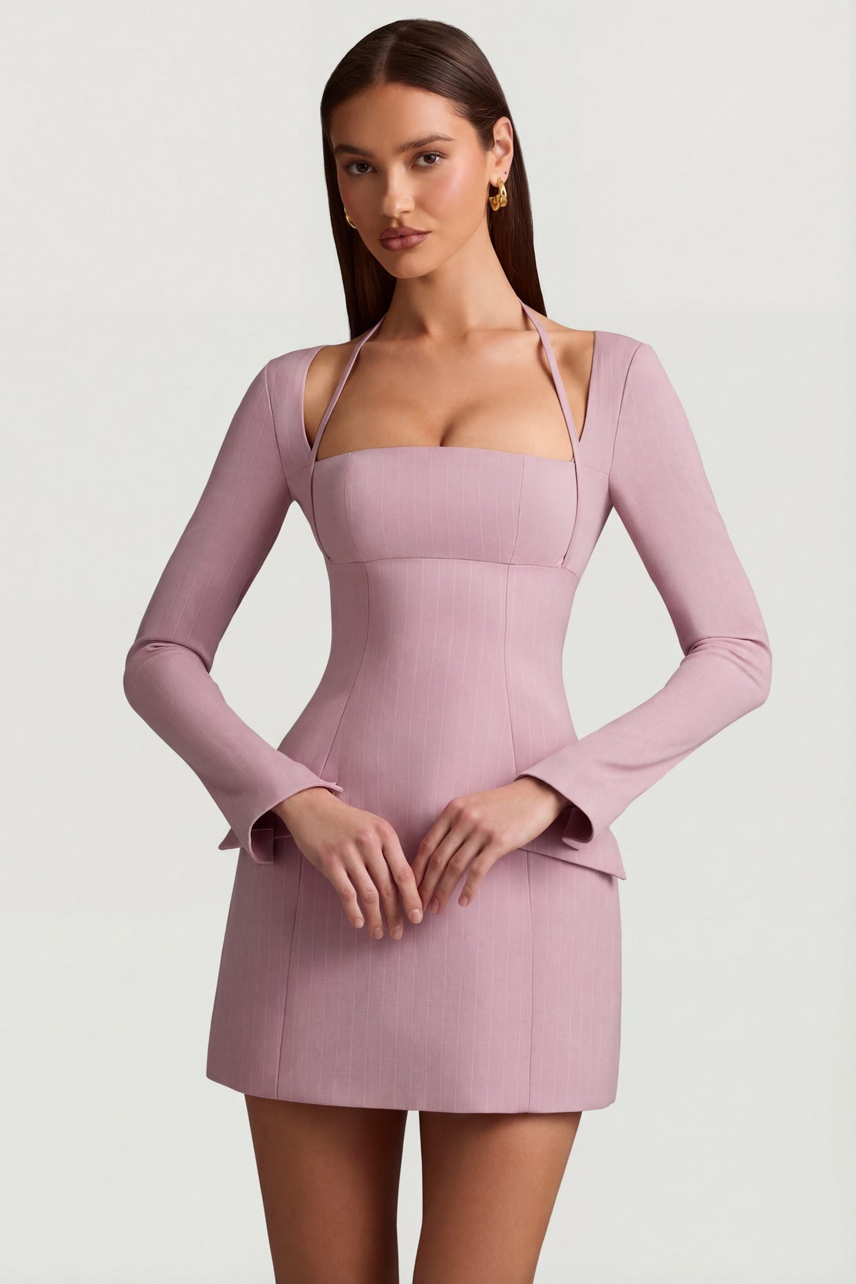 Oh Polly's Anna wearing the Ksenia Mini Dress in Mauve Stretch Woven fabric perfect for rooftop drinks