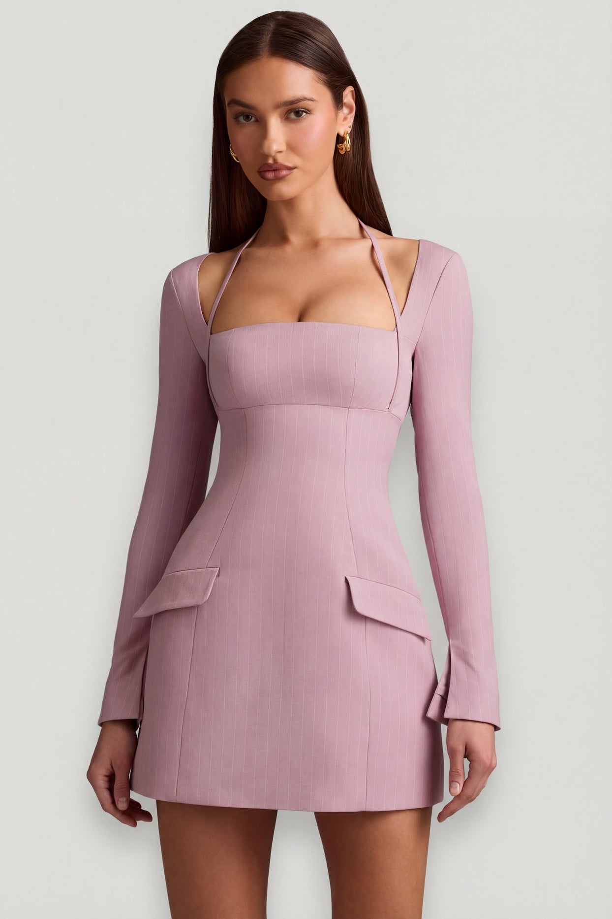 Oh Polly's Anna wearing the Ksenia Mini Dress in Mauve Stretch Woven fabric perfect for a fancy dinner