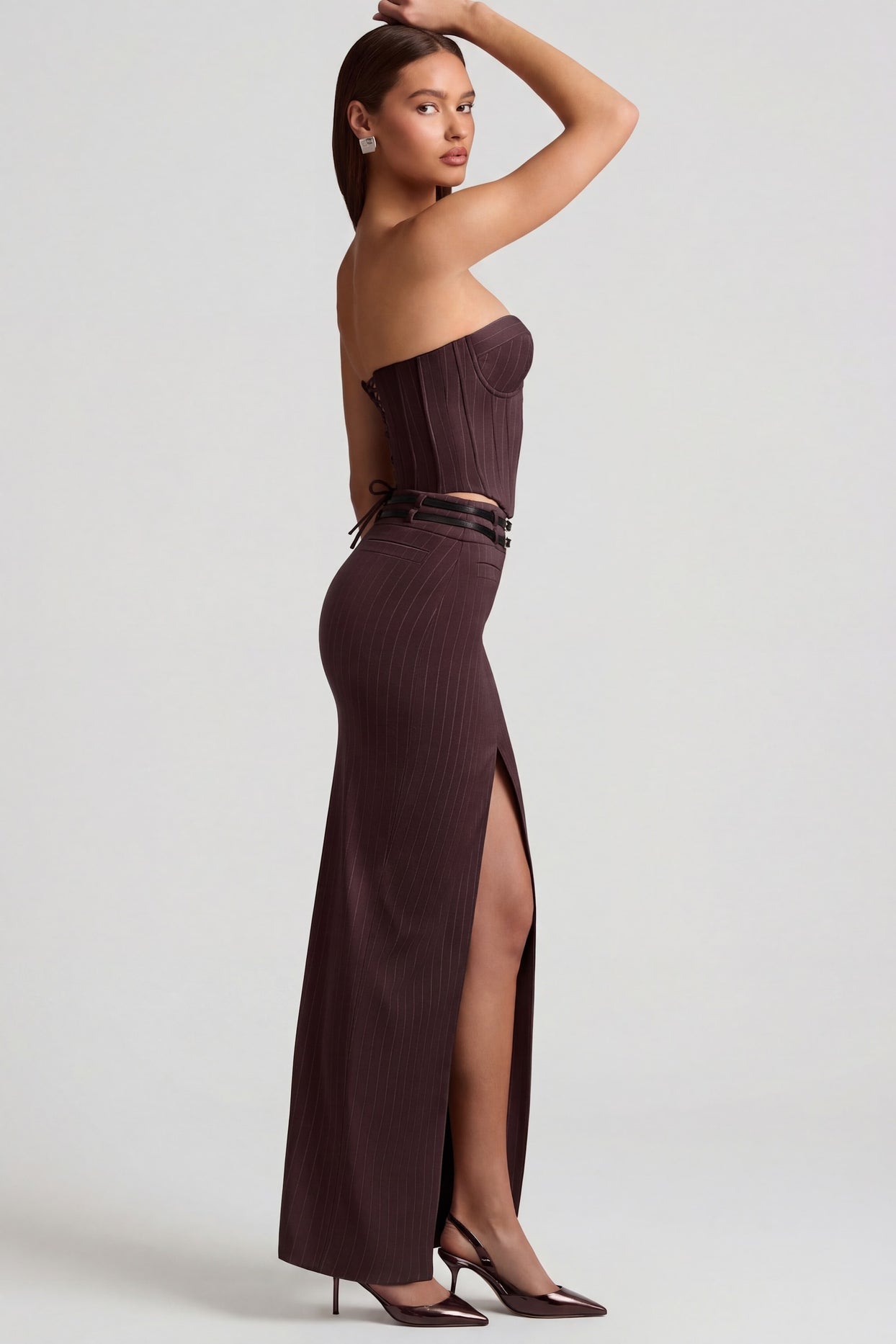 Oh Polly's Anna wearing the Liora Maxi Skirt in Chocolate Brown fabric perfect for evening parties