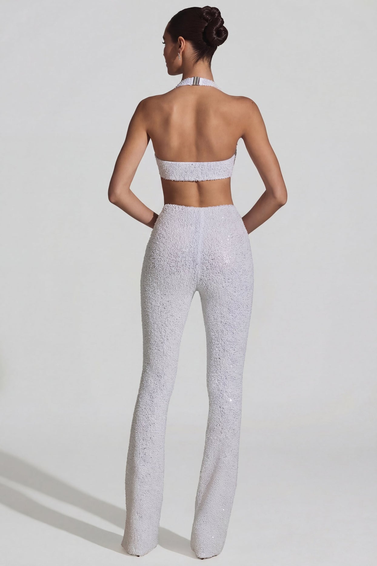 Oh Polly's Anna wearing the Coralena Regular Jumpsuit in White Embellished, Mesh fabric perfect for cocktail evenings