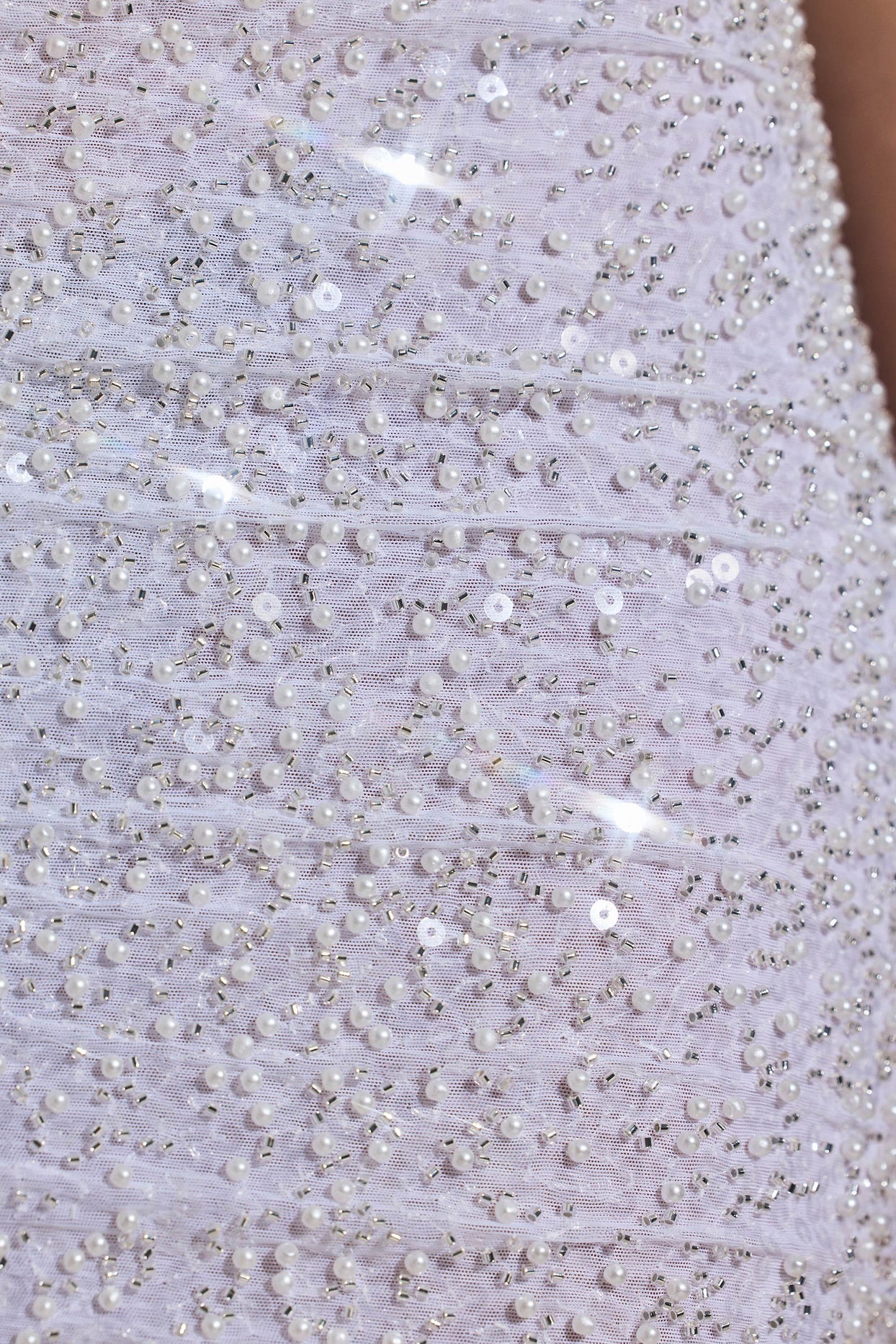 Oh Polly's Anna wearing the Lucia Mini Dress in White Embellished, Mesh fabric perfect for holiday dinners