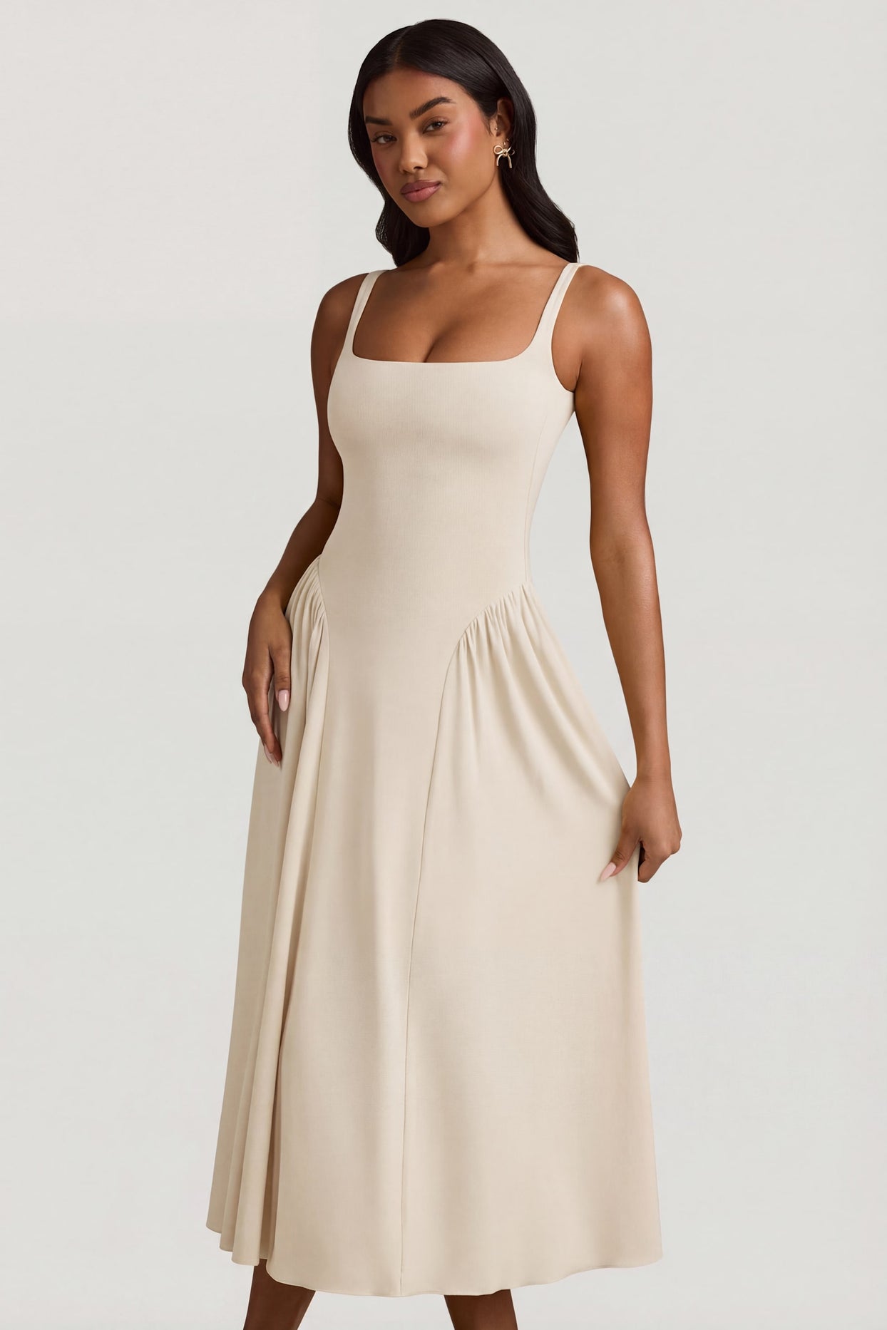 Oh Polly's Yarelis wearing the Aireen Midaxi Dress in Ivory Modal fabric perfect for cocktail hour soirées