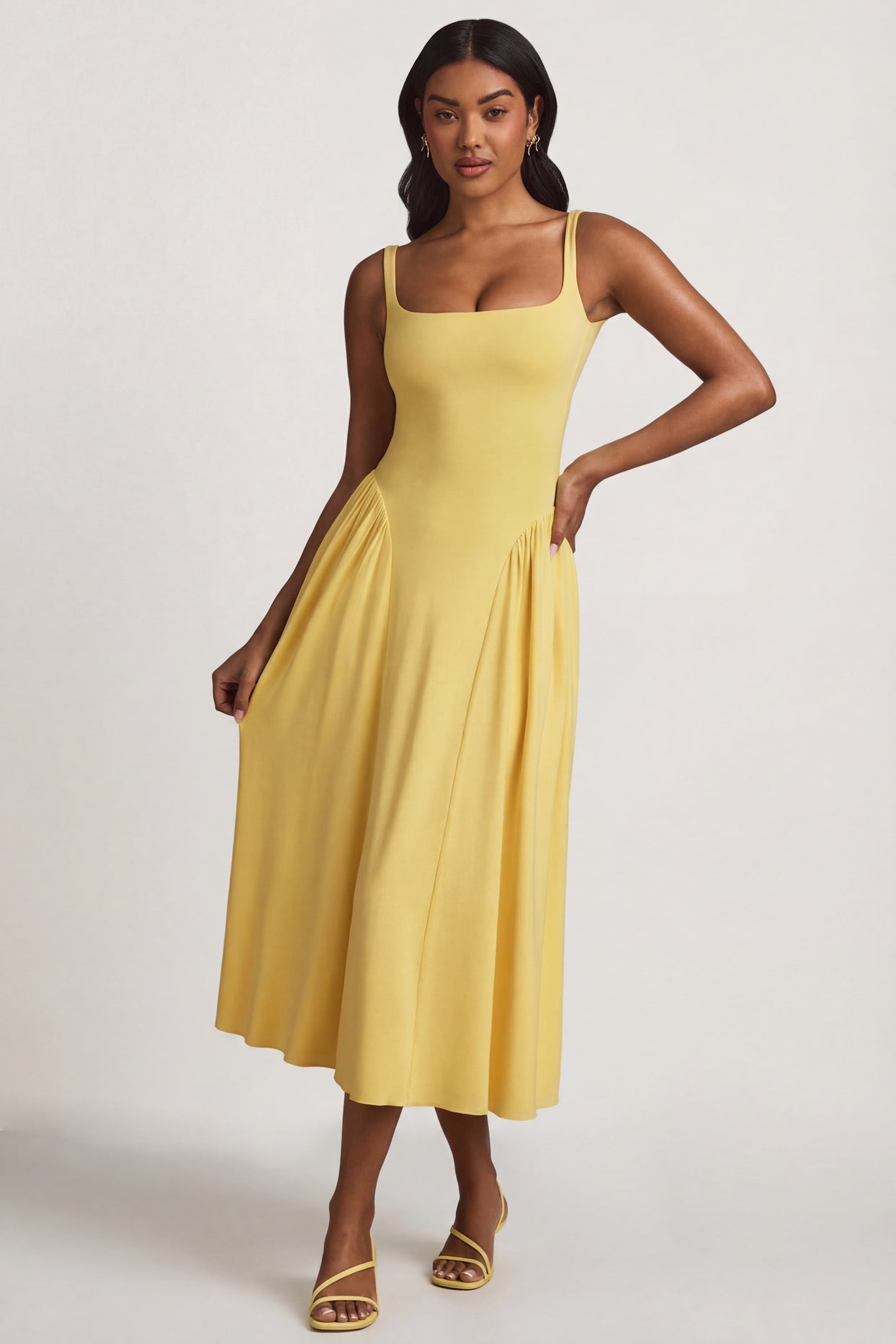 Oh Polly's Yarelis wearing the Aireen Midaxi Dress in Pastel Yellow Modal fabric perfect for summer garden parties