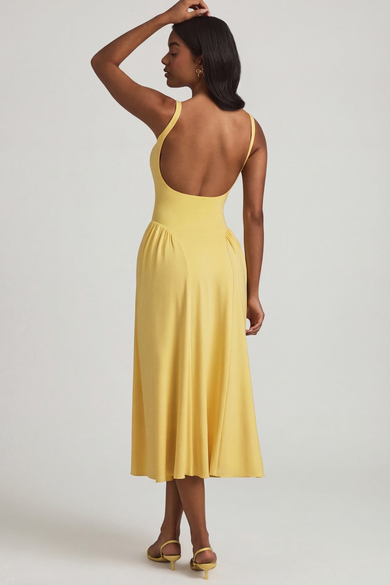 Oh Polly's Yarelis wearing the Aireen Midaxi Dress in Pastel Yellow Modal fabric perfect for summer garden parties