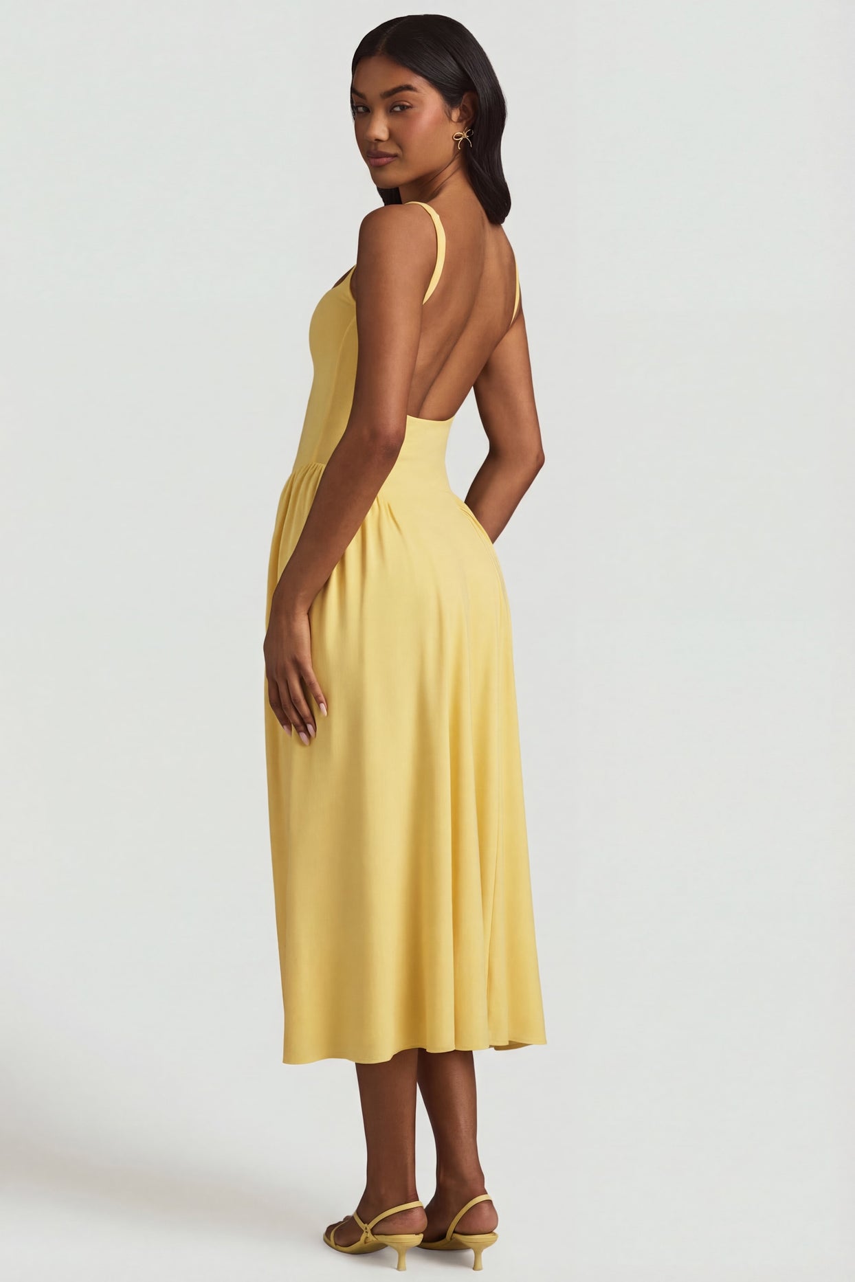 Oh Polly's Yarelis wearing the Aireen Midaxi Dress in Pastel Yellow Modal fabric perfect for brunch with friends