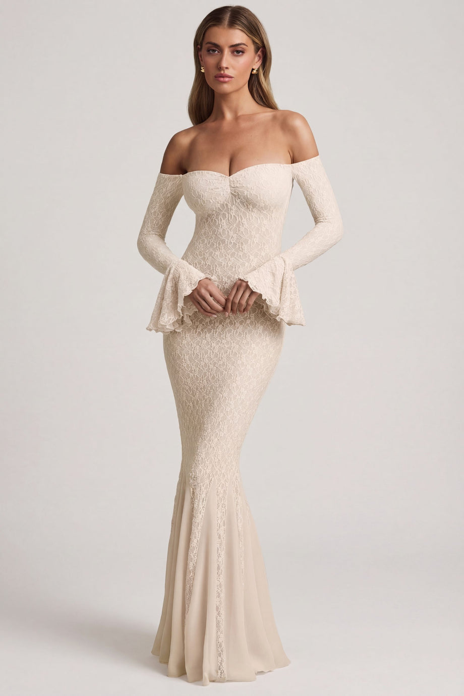 Oh Polly's Freya Tidy wearing the Verena Maxi Dress in Ivory Stretch Lace fabric perfect for beachside dinners