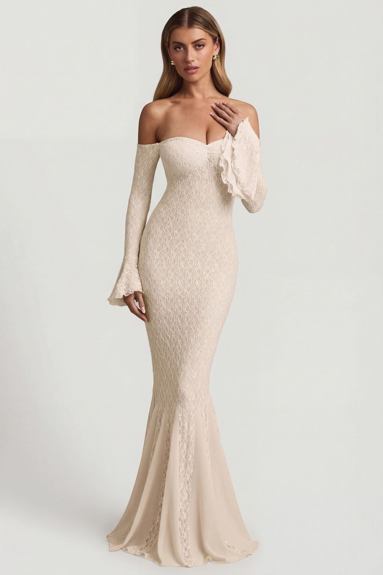 Oh Polly's Freya Tidy wearing the Verena Maxi Dress in Ivory Stretch Lace fabric perfect for cocktail receptions