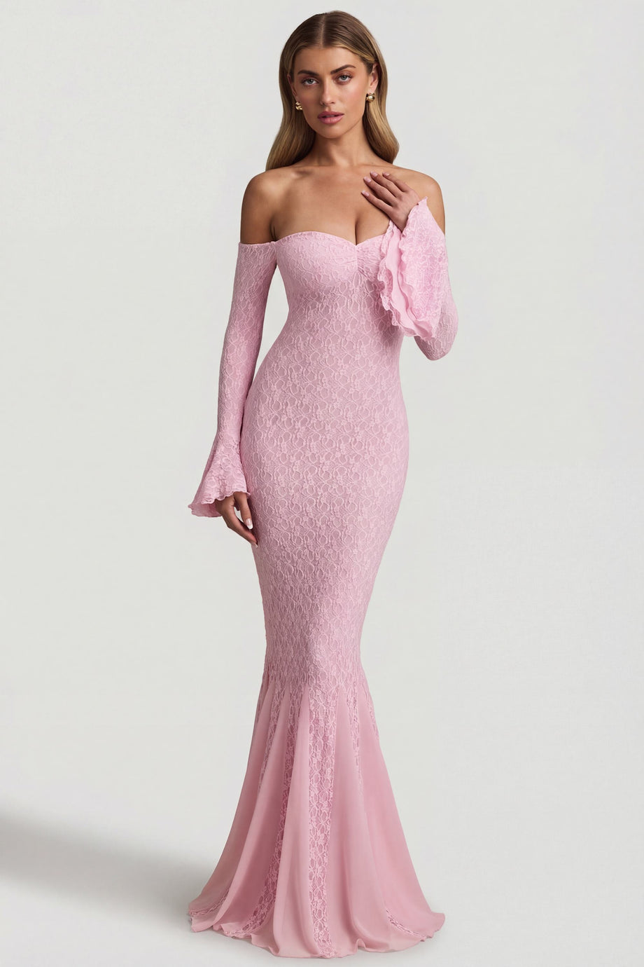 Oh Polly's Freya Tidy wearing the Verena Maxi Dress in Soft Pink Stretch Lace fabric perfect for cocktail receptions