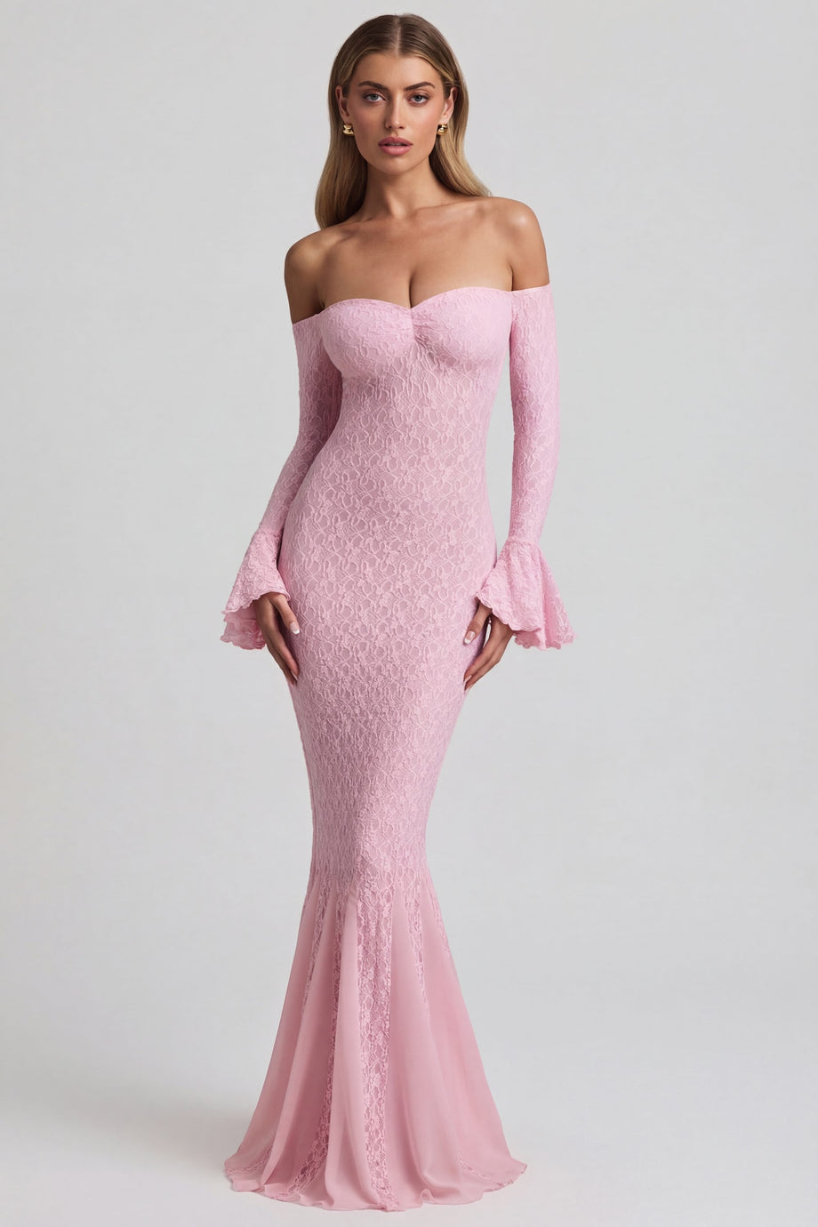 Oh Polly's Freya Tidy wearing the Verena Maxi Dress in Soft Pink Stretch Lace fabric perfect for upscale dinners