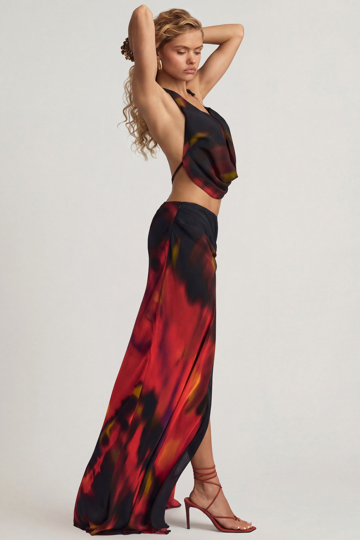 Oh Polly's Juliana Nulu wearing the Keona Maxi Skirt in Red Blurred Print Chiffon fabric perfect for garden brunches