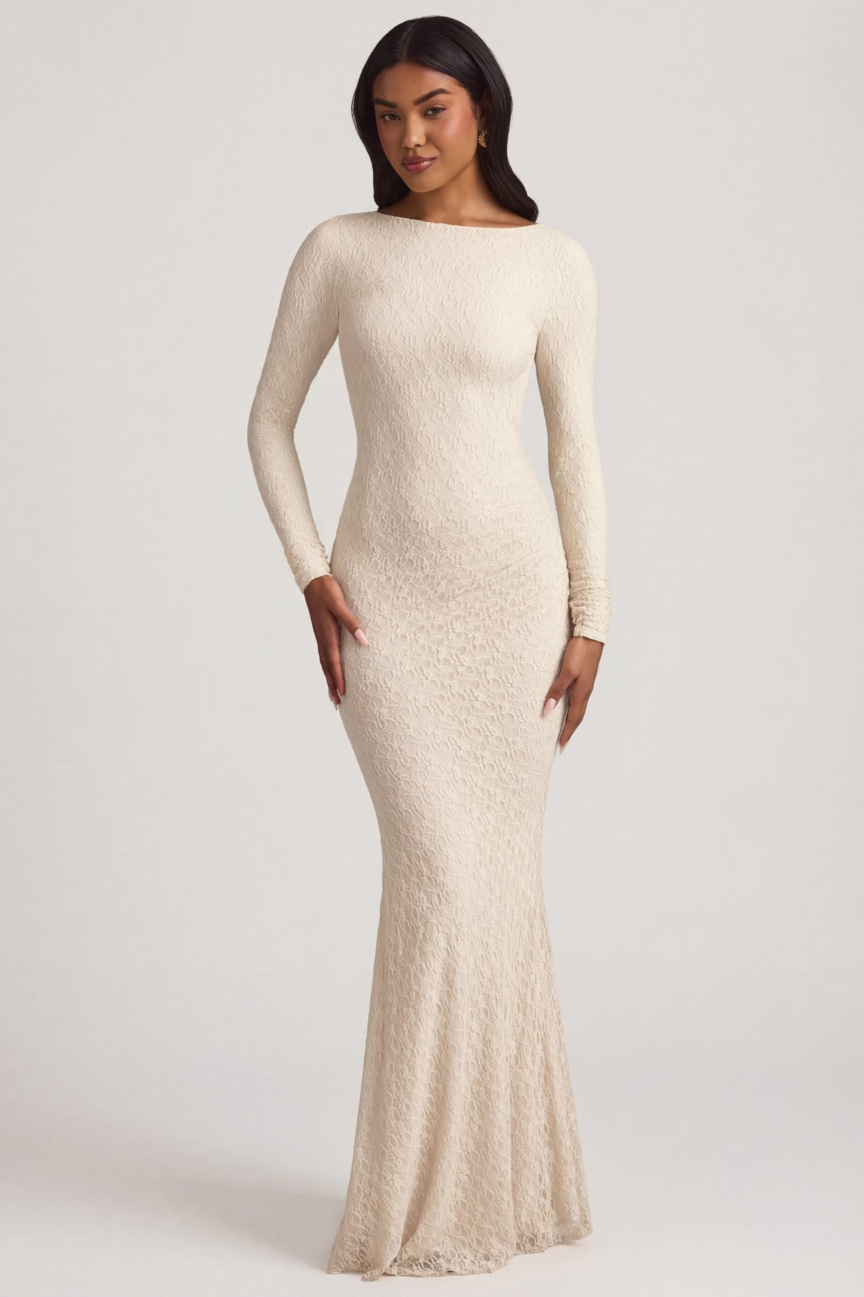 Oh Polly's Yarelis wearing the Tarini Maxi Dress in Ivory Stretch Lace fabric perfect for summer garden parties