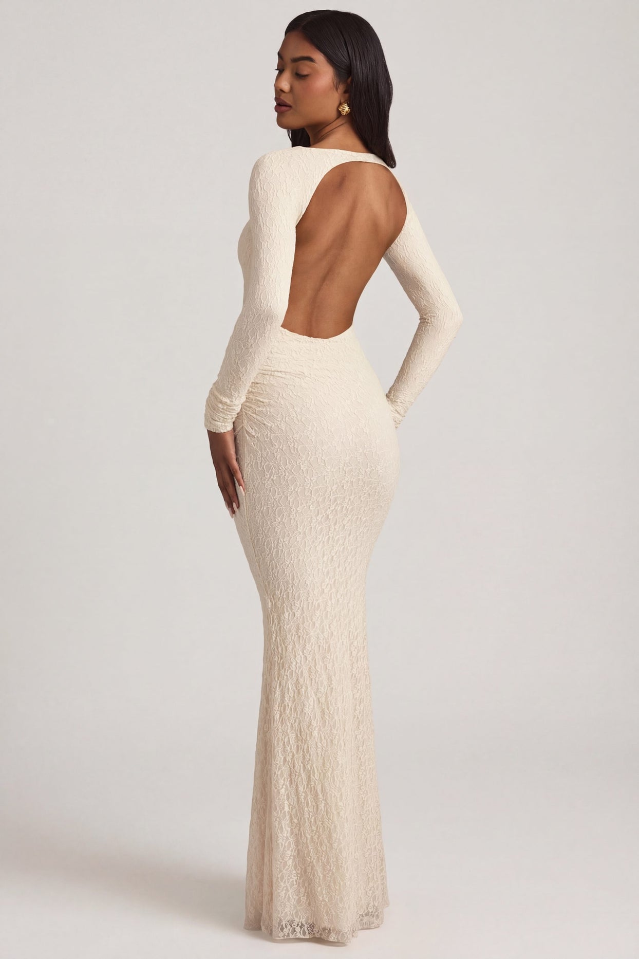 Oh Polly's Yarelis wearing the Tarini Maxi Dress in Ivory Stretch Lace fabric perfect for elegant evening events