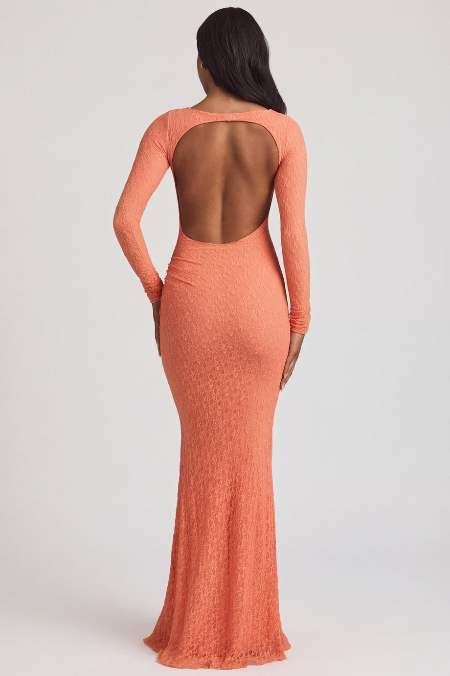 Oh Polly's Yarelis wearing the Tarini Maxi Dress in Peach Stretch Lace fabric perfect for summer garden parties