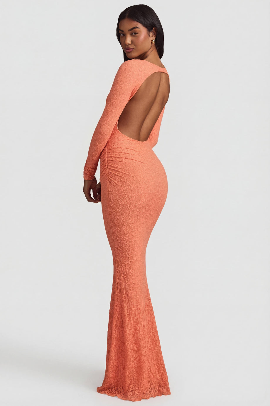 Oh Polly's Yarelis wearing the Tarini Maxi Dress in Peach Stretch Lace fabric perfect for romantic date nights