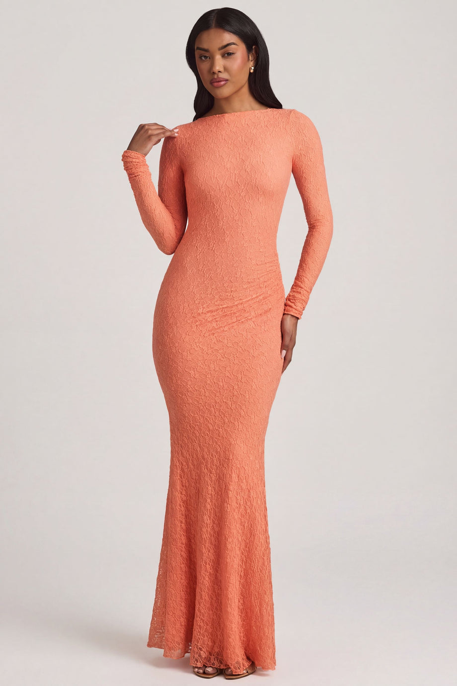 Oh Polly's Yarelis wearing the Tarini Maxi Dress in Peach Stretch Lace fabric perfect for destination weddings