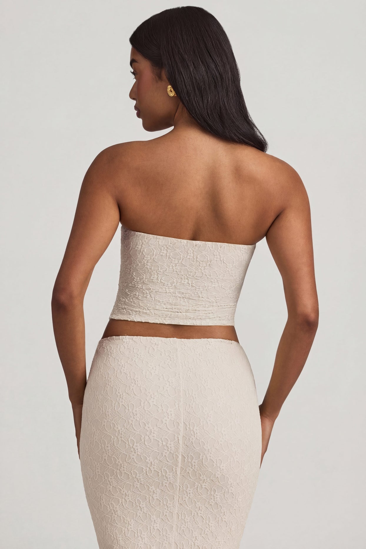 Oh Polly's Yarelis wearing the Tamia Full Top in Ivory Stretch Lace fabric perfect for summer garden parties