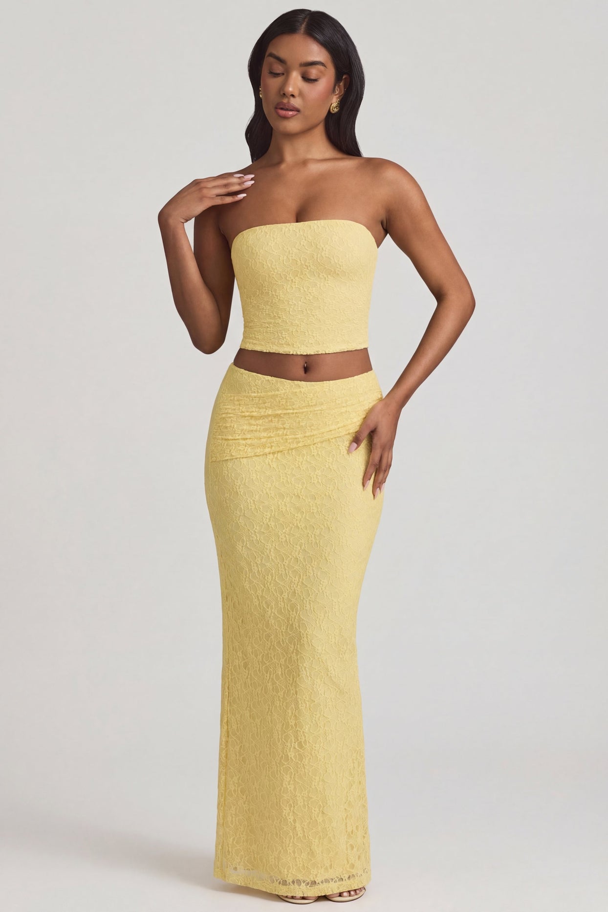 Oh Polly's Yarelis wearing the Tamia Full Top in Pastel Yellow Stretch Lace fabric perfect for summer brunches
