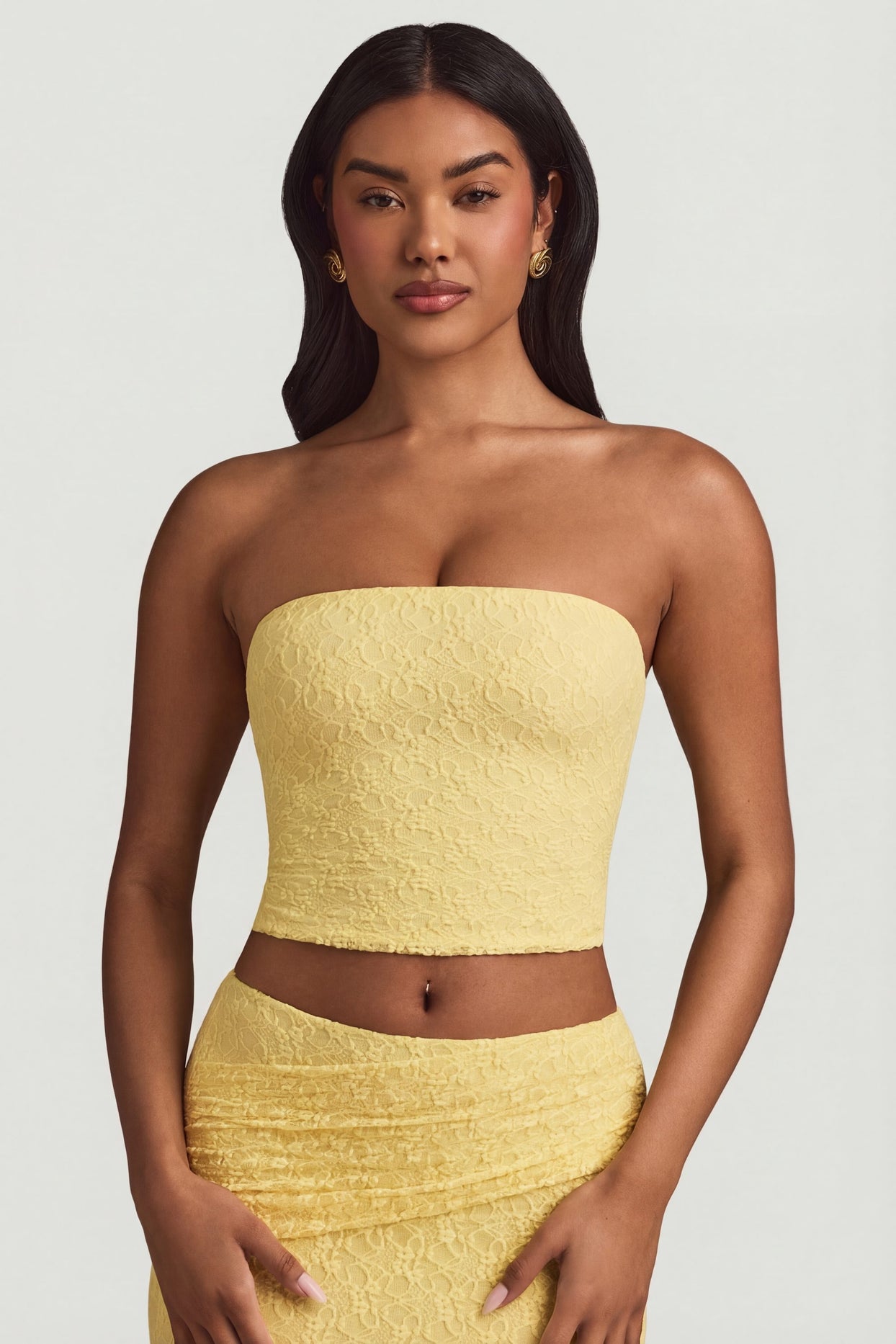 Oh Polly's Yarelis wearing the Tamia Full Top in Pastel Yellow Stretch Lace fabric perfect for daytime dates