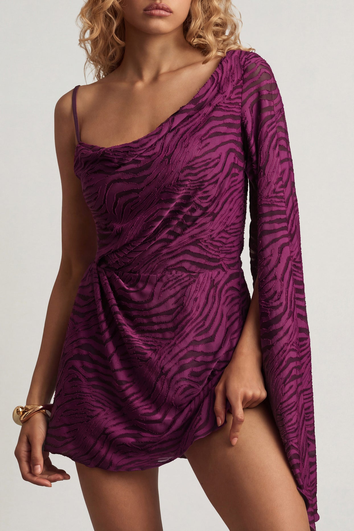 Oh Polly's Juliana Nulu wearing the Angelie Mini Dress in Berry Purple Croc Jersey fabric perfect for girls' night out