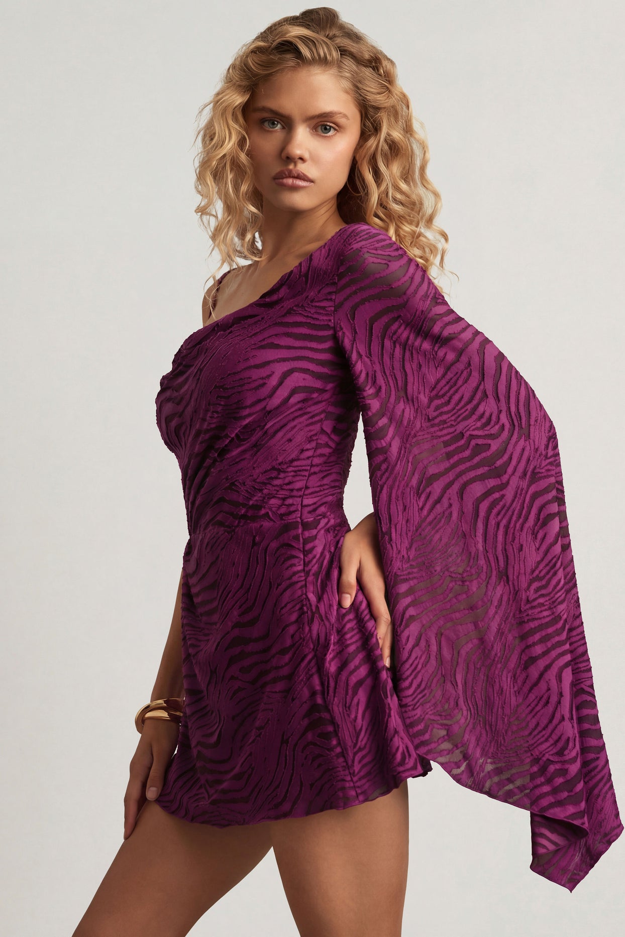 Oh Polly's Juliana Nulu wearing the Angelie Mini Dress in Berry Purple Croc Jersey fabric perfect for birthday celebrations