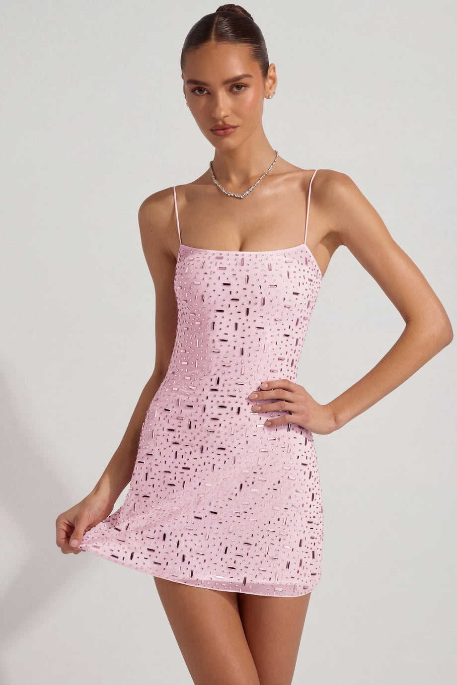 Oh Polly's Anna wearing the Averie Mini Dress in Pink Mesh fabric perfect for birthday celebrations