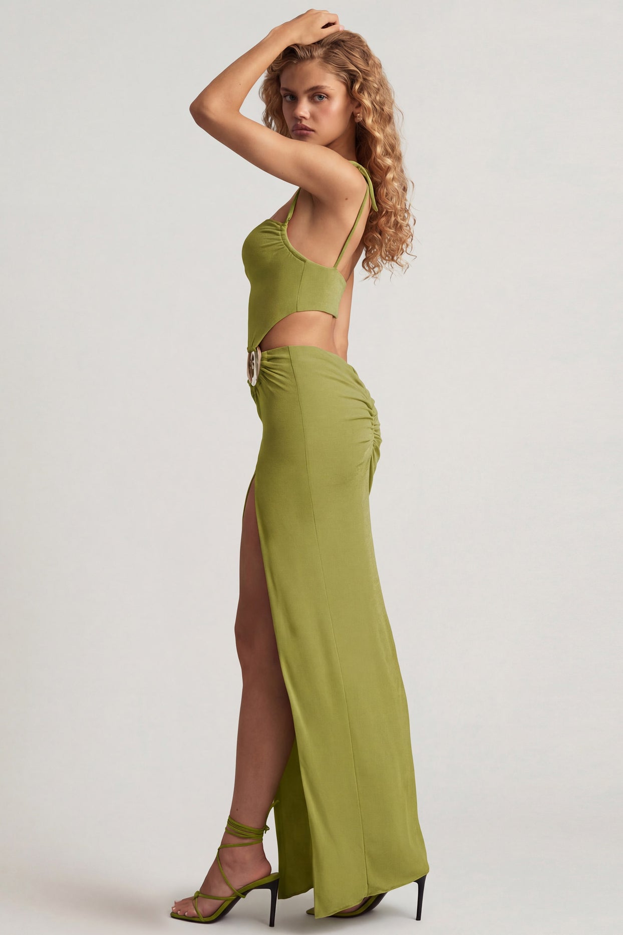 Oh Polly's Juliana Nulu wearing the Imara Maxi Dress in Olive Green Textured Jersey fabric perfect for wedding guest style
