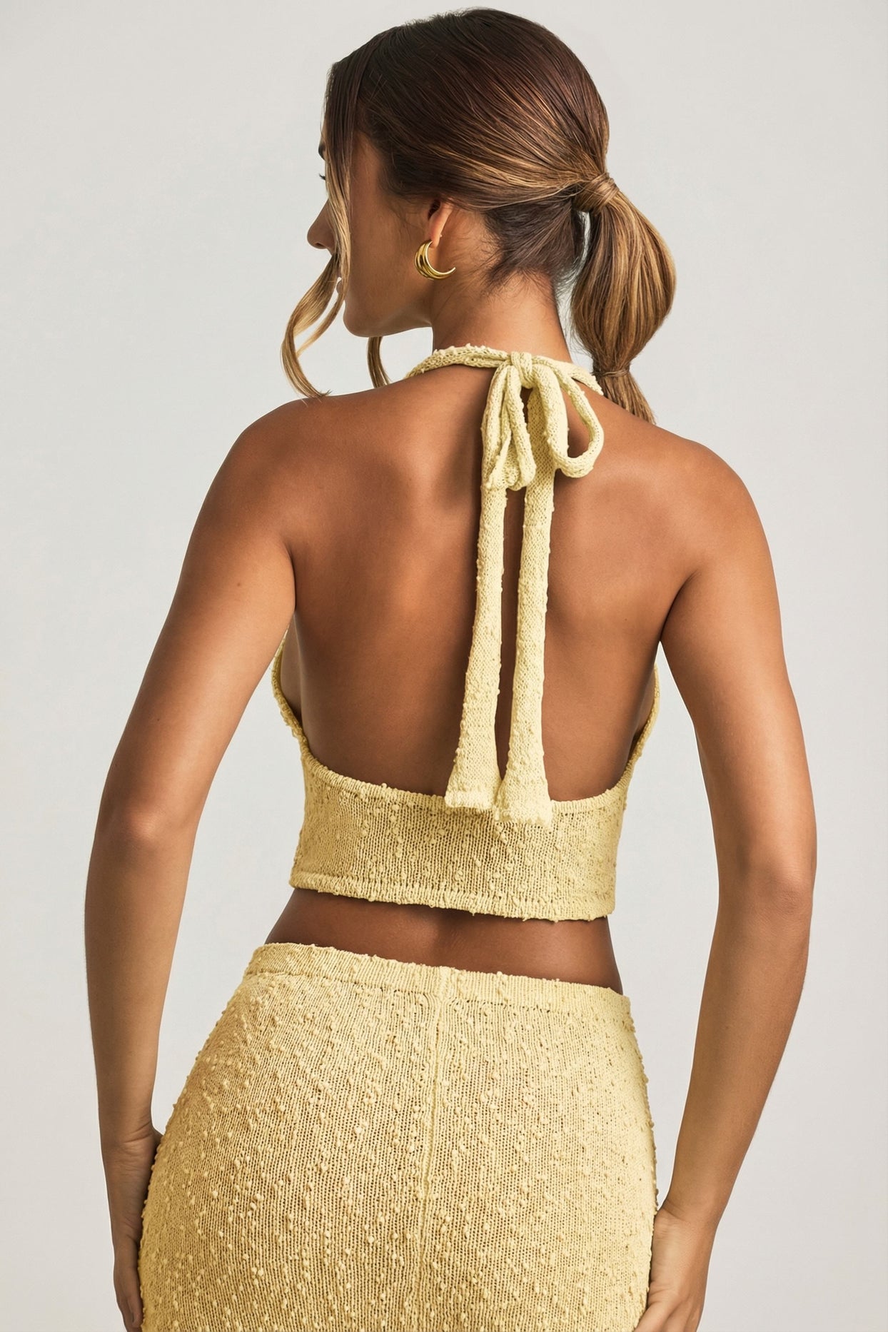 Oh Polly model Priscilla wearing the Gianna Full Top in Yellow Boucle Knit fabric perfect for casual outings